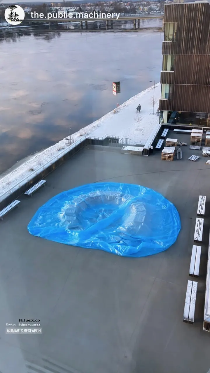 Story by the.public.machinery: the blue membrane laid out on the terrace by the river